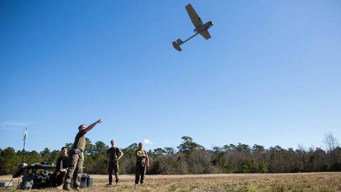 A Marine launches a Raven small unmanned aircraft system into the air at Marine Corps Base Camp Lejeune, N.C., March 27, 2017. Marines conducted aerial training exercises at Tactical Landing Zone Dove to demonstrate the capabilities and build familiarization with the SUAS. The Marines are intelligence specialists with 2nd Battalion, 8th Marine Regiment. 