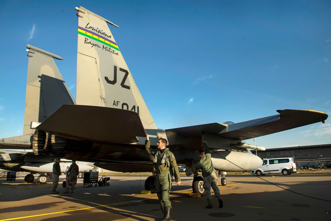 Air Force Maj. Joshua Higgins conducts a pre-flight inspection on a F-15C Eagle aircraft at Leeuwarden Air Base in the Netherlands, March 28, 2017. Higgins is a pilot assigned to the 122nd Expeditionary Fighter Squadron. Air Force photo by Staff Sgt. Jonathan Snyder