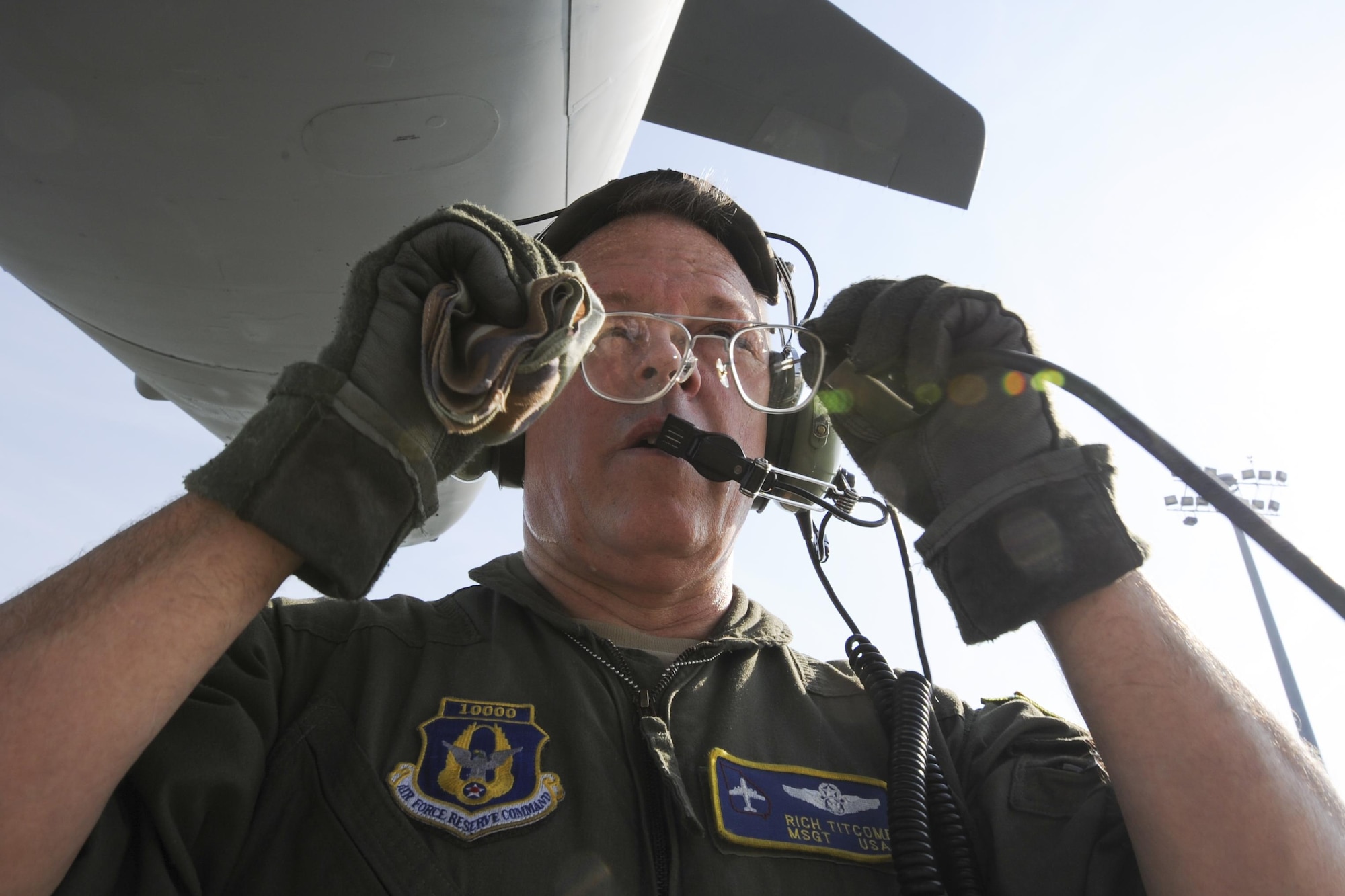 Master Sgt. Richard Titcomb, 339th Flight Test Squadron C-5 flight engineer, readjusts his glasses while performing pre-flight checks to a C-5M Super Galaxy March 29, 2017, at Robins Air Force Base, Ga. Titcomb has been with the squadron for nearly two years. (U.S. Air Force photo by Jamal D. Sutter)