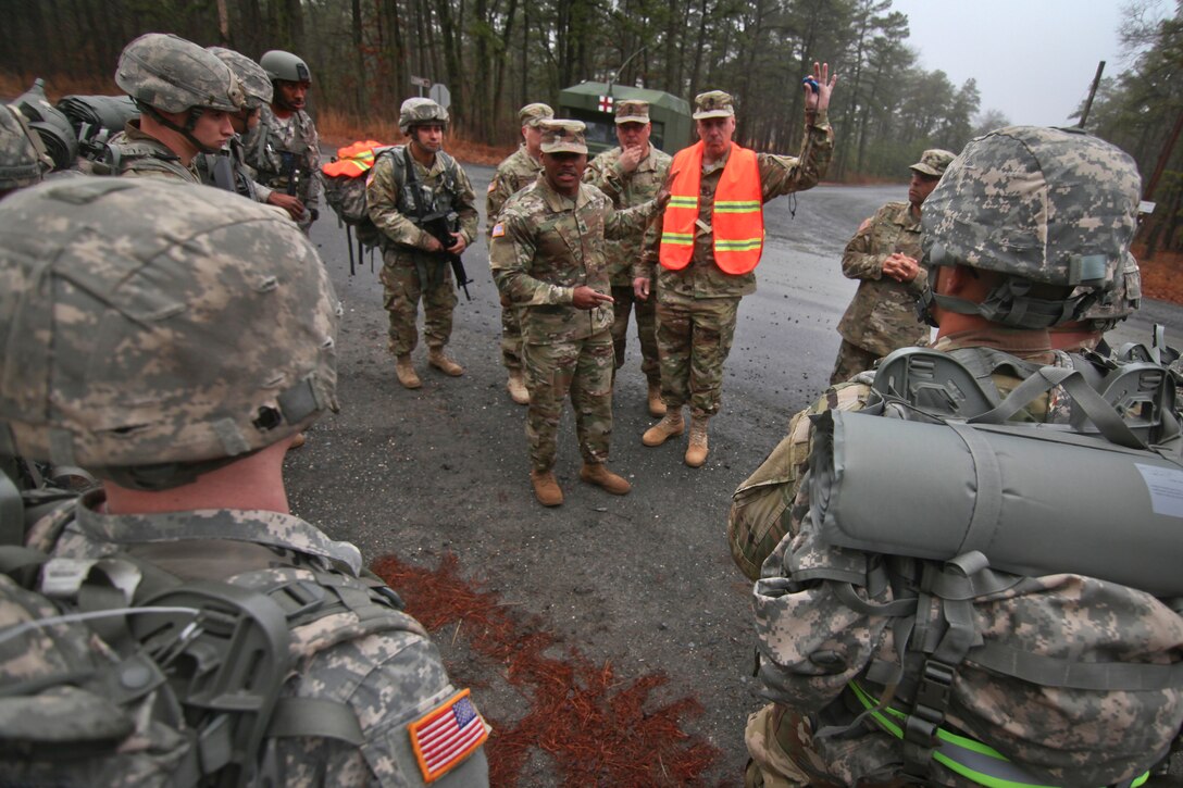 New Jersey Army National Guard members listen to a safety briefing before participating in a 12-mile ruck march during the Best Warrior 2017 competition at Joint Base McGuire-Dix-Lakehurst, N.J., March 28, 2017. Soldiers are competing in timed events, including urban-warfare simulations, a 12-mile rucksack march, land navigation and the Army physical fitness test. Air National Guard photo by Master Sgt. Matt Hecht