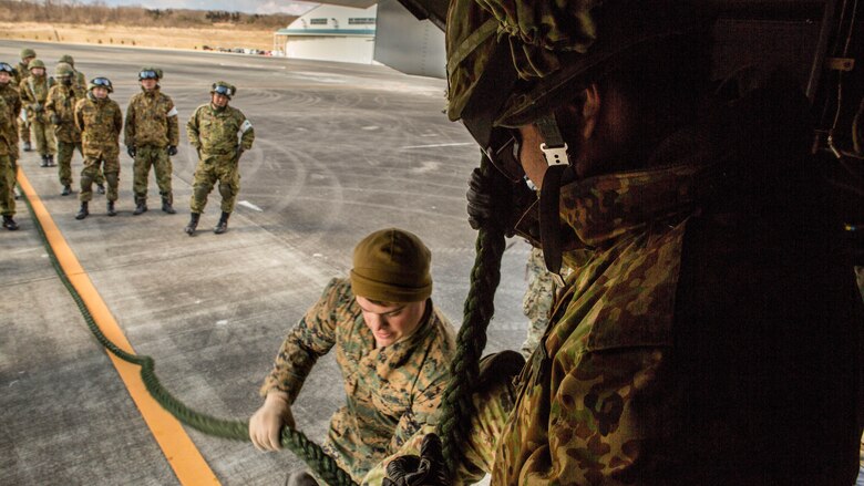 Sgt. Matthew Bennett instructs a member from the Japan Ground Self-Defense Force, 30th Infantry Regiment, 12th Brigade, Eastern Army on how to properly fast rope out of an MV-22B tiltrotor aircraft during Forest Light 17-1 at Camp Soumagahara, Japan March 10, 2017. Forest Light is a routine, semi-annual exercise conducted by U.S. and Japan forces in order to strengthen our interoperability and combined capabilities in defense of the U.S.-Japan alliance. Bennett is a fast rope master from Bear, Delaware with Company G, 2nd Battalion, 3rd Marine Regiment, 3rd Marine Division, III Marine Expeditionary Force. 