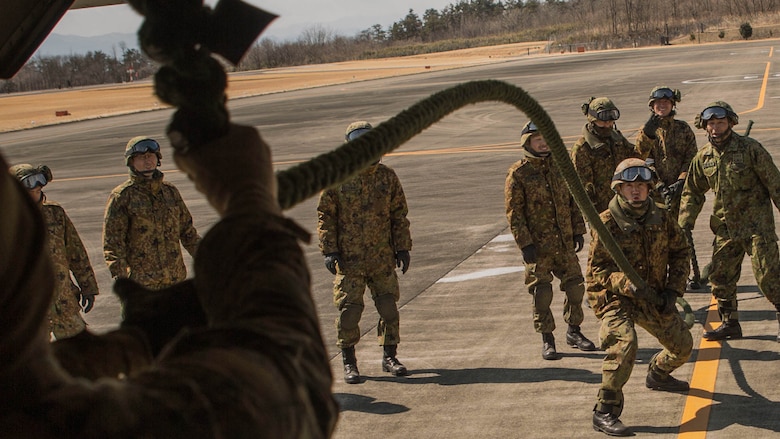 A member of the Japan Ground Self-Defense Force, 30th Infantry Regiment, 12th Brigade, Eastern Army, simulates what happens to the rope while fast roping out of an MV-22B tiltrotor aircraft on Camp Soumagahara, Japan March 10, 2017 as part of Forest Light 17-1. Forest Light is a routine, semi-annual exercise conducted by U.S. and Japan forces in order to strengthen our interoperability and combined capabilities in defense of the U.S.-Japan alliance. 