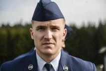 Airman Seth Ringwalt, 86th Civil Engineer Squadron structural apprentice, participates in a ceremony to honor the memory of the Wereth 11, in Wereth, Belgium, March 24, 2017. Community members from the village of Wereth and Airmen from Ramstein Air Base and Spangdahlem Air Base came together to perform a ceremony to recognize the lives of 11 African American soldiers, now known as the Wereth 11. Those 11 soldiers fought bravely in the battle of Normany and the Battle of the Bulge, but were later captured, tortured and executed by the Nazi SS Dec. 17 1944. (U.S. Air Force photo by Tech Sgt. Sara Keller) 
