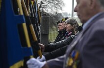 Volunteer honor guardsman from the village of Wereth, Belgium present flags during a ceremony to honor the memory of the Wereth 11, in Wereth, Belgium, March 24, 2017.  Every year, community members joined Airmen from Ramstein Air Base and Spangdahlem Air Base to conduct a ceremony to honor 11 African American soldiers, now known as the Wereth 11, who were captured, tortured and executed by the Nazi SS during World War II. (U.S. Air Force photo by Tech Sgt. Sara Keller) 