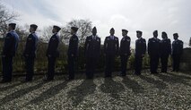 Eleven Airmen from the 86th Civil Engineer Squadron and 86th Logistics Readiness Squadron, stand in line to represent the Wereth 11, during a ceremony in Wereth, Belgium, March 24, 2017. Each Airmen reported “not present” as each of the Soldier’s names were read off in ceremonial fashion. The ceremony was held to recognize 11 African American soldiers, now known as the Wereth 11, who were tortured and executed by the Nazi SS Dec. 17, 1944 in the small village of Wereth. (U.S. Air Force photo by Tech Sgt. Sara Keller)