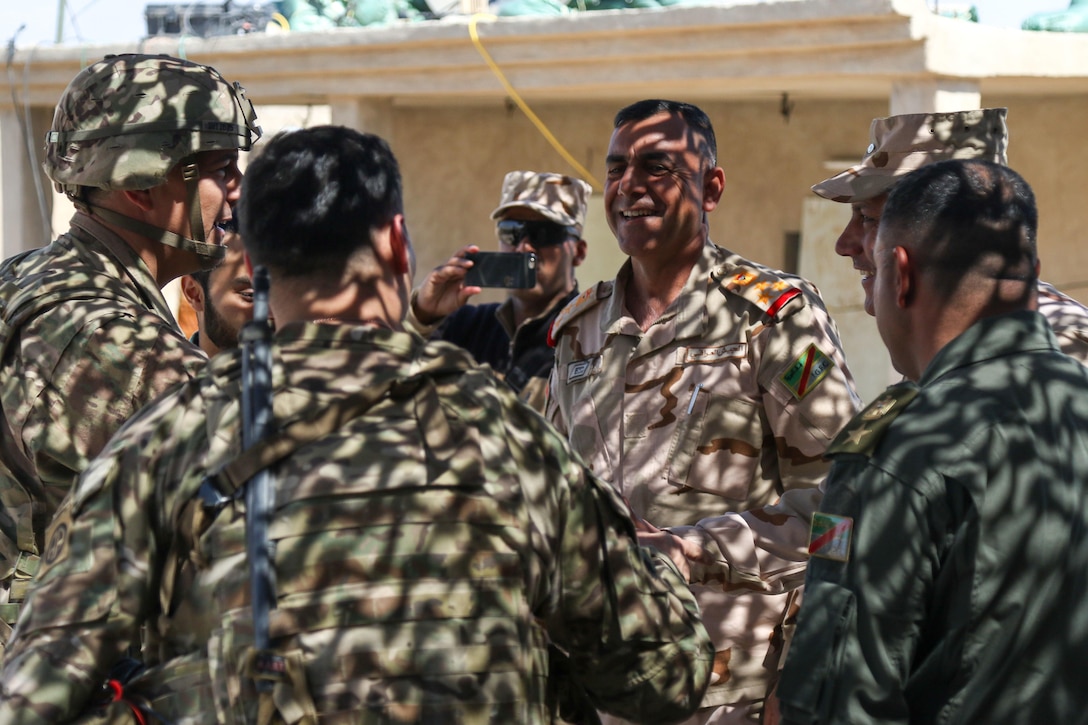 U.S. Army Lt. Gen. Stephen Townsend, commanding general, Combined Joint Task Force-Operation Inherent Resolve, XVIII Airborne Corps, left, visits with leaders of the 9th Iraqi Army Division, near Al Tarab, Iraq, March 27, 2017. The 2nd Brigade Combat Team, 82nd Airborne Division, advises and assists the 9th Iraqi Army Division, contributing planning, intelligence collection and analysis, force protection, and precision fires to achieve the military defeat of ISIS. CJTF-OIR is the global Coalition to defeat ISIS in Iraq and Syria. (U.S. Army photo by Staff Sgt. Jason Hull)