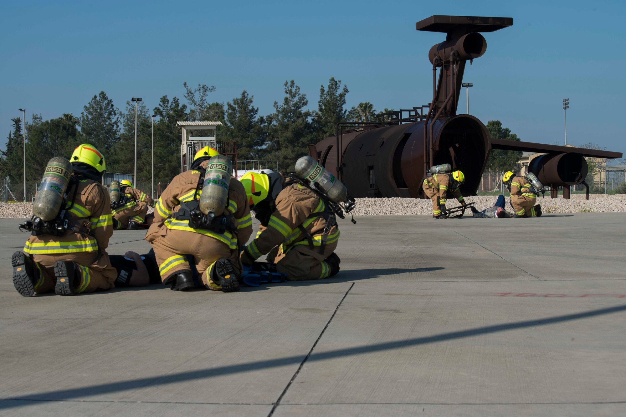 Firefighters with the 39th Civil Engineer Squadron, work together to aid multiple simulated aircraft accident victims during a major accident response exercise (MARE) March 29, 2017, at Incirlik Air Base, Turkey. A MARE is designed to test an installation’s ability to respond to different events that could negatively impact the mission. (U.S. Air Force photo by Airman 1st Class Devin M. Rumbaugh)