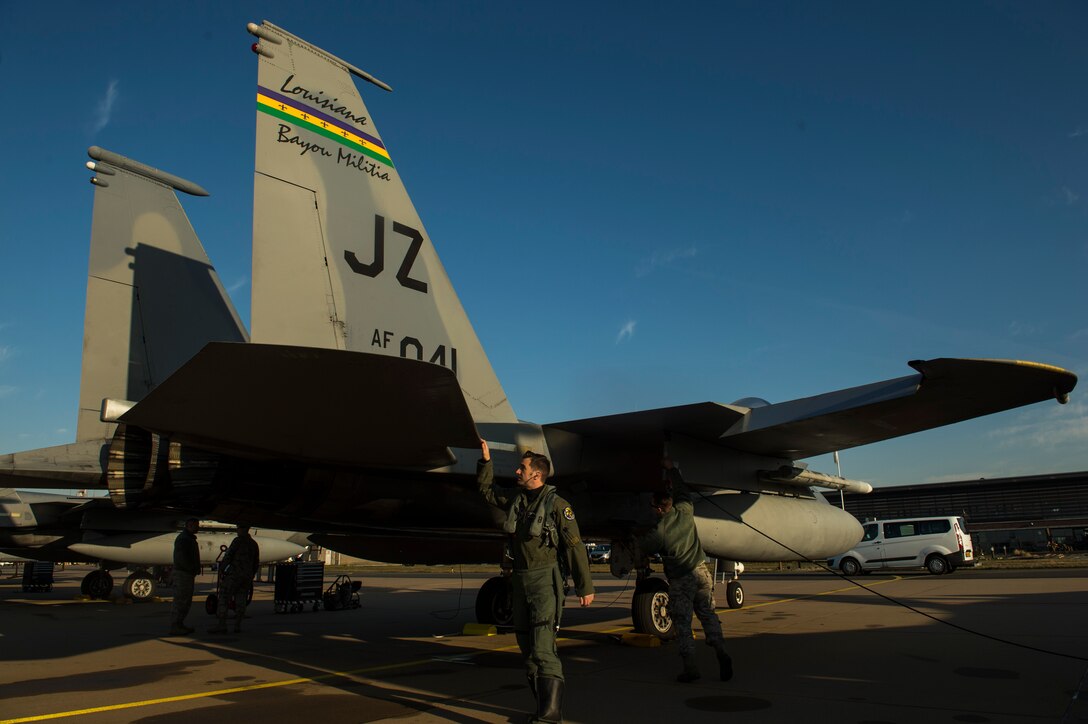 Maj. Joshua Higgins, 122nd Expeditionary Fighter Squadron pilot, conducts a pre-flight inspection on a F-15C Eagle at Leeuwarden Air Base, Netherlands, March 28, 2017. The 122nd Expeditionary Fighter Squadron, comprised of Louisiana and Florida Air National Guard aircraft, will conduct training alongside NATO allies to strengthen interoperability and demonstrate U.S. commitment to the security and stability of Europe. (U.S. Air Force photo by Staff Sgt. Jonathan Snyder)