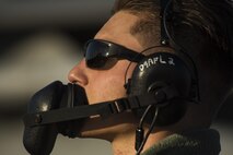 Airman 1st Class Josh Herzog, 159th Aircraft Maintenance Squadron crew chief, communicates with the pilot while conducting a pre-flight inspection on a F-15C Eagle at Leeuwarden Air Base, Netherlands, March 28, 2017. The 122nd Expeditionary Fighter Squadron, comprised of Louisiana and Florida Air National Guard aircraft, deployed to Europe to participate as a Theater Security Package. These F-15s will conduct training alongside NATO allies to strengthen interoperability and to demonstrate U.S. commitment to the security and stability of Europe. (U.S. Air Force photo by Staff Sgt. Jonathan Snyder)