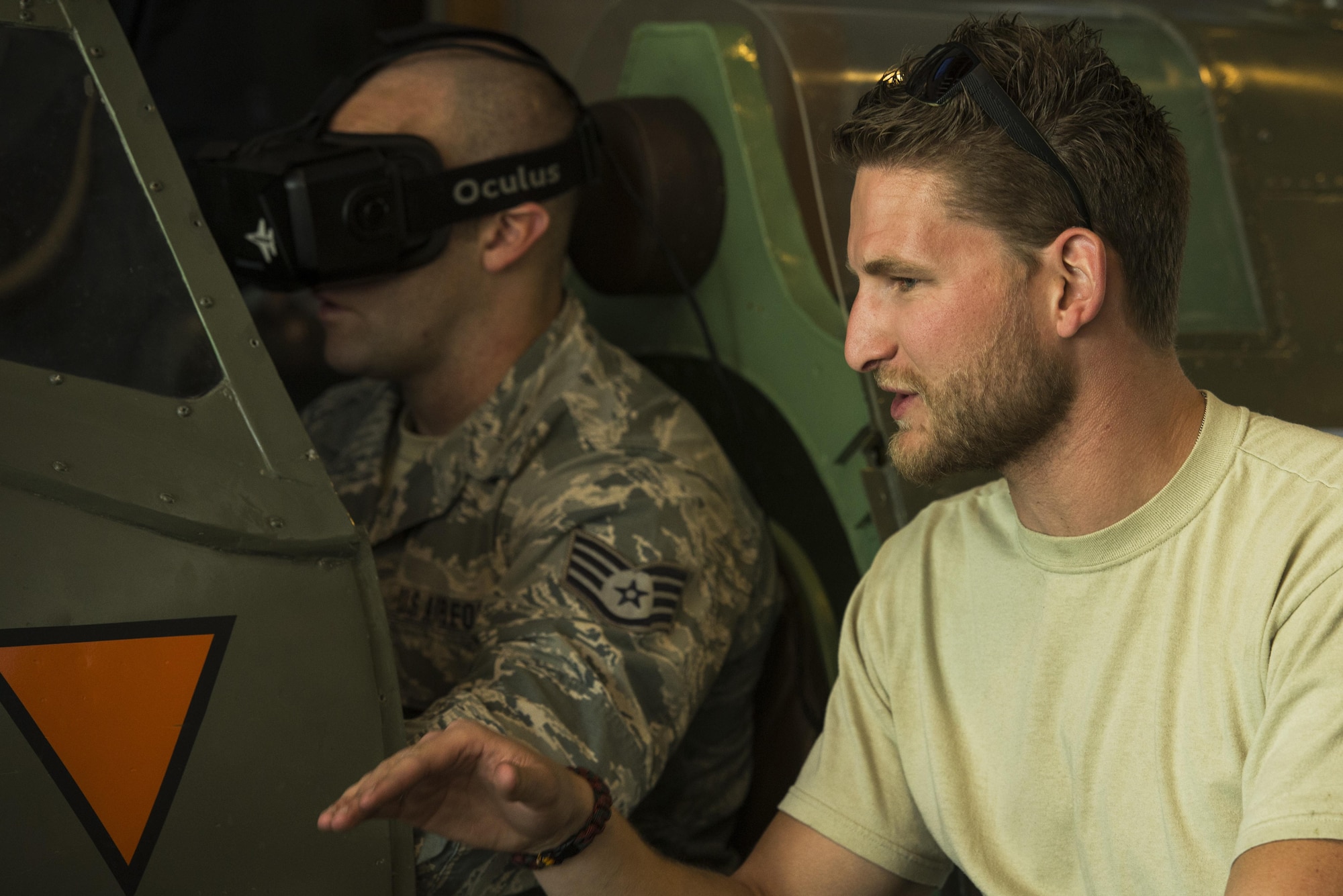 Staff Sgt. Geremy Stovall, left, 159th Maintenance Squadron aerospace reclamation technician, listens to instructions from Royal Netherlands air force Sgt. 1st Class Robbert Kwantes, right, 322nd Squadron crew chief, while piloting their Spitfire flight simulator during an ice breaker social event at Leeuwarden Air Base, Netherlands, March 28, 2017. The U.S. Air Force deployed approximately 300 Airmen along with 12 F-15Cs to Europe as a part of a Theater Security Package in support of Operation Atlantic Resolve. While in theater these aircraft will participate in Royal Netherlands Air Force-led exercise, Frisian Flag, and will then forward deploy to European NATO nations for approximately six months. (U.S. Air Force photo by Staff Sgt. Jonathan Snyder)