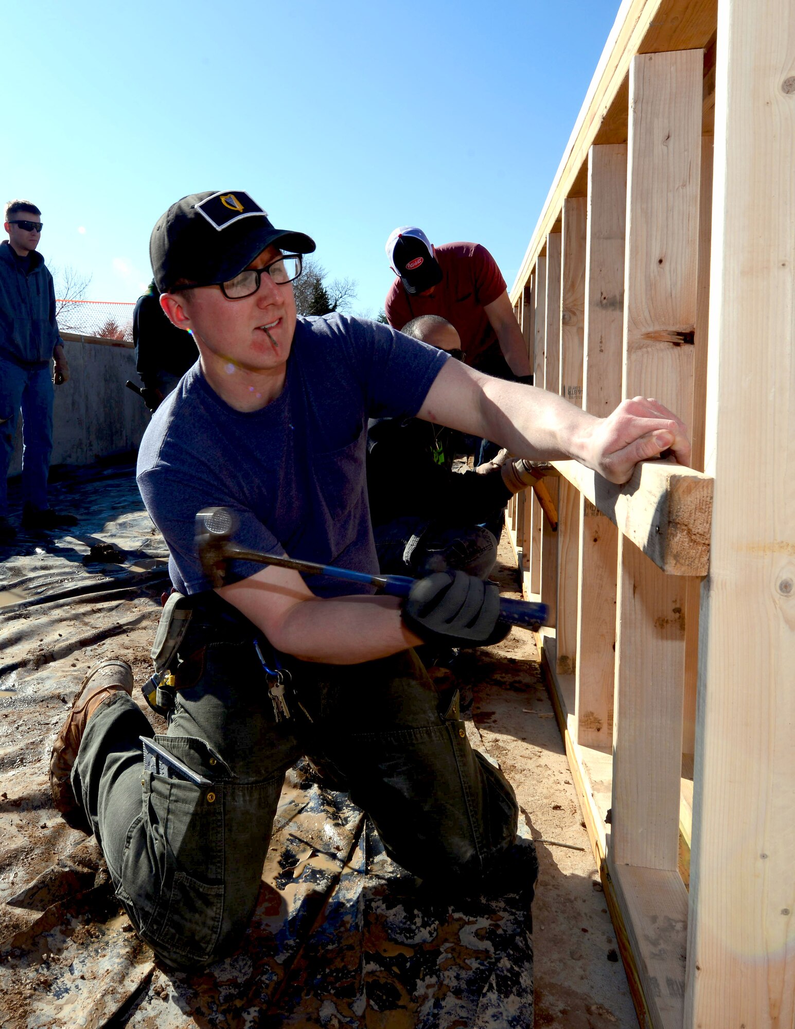 Airman 1st Class Tyler Robinson, a power production journeyman assigned to the 28th Civil Engineer Squadron, helps install low-barring walls in a Habitat for Humanity home training in Rapid City, S.D., March 23, 2017. The 28th CES conducts monthly training with Habitat for Humanity to improve their construction skills, while also giving back to the local community. (U.S. Air Force photo by Airman 1st Class Donald C. Knechtel)