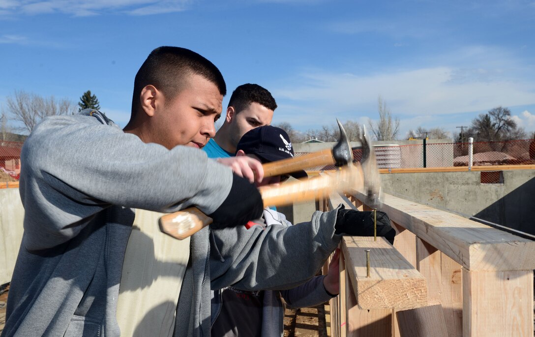 Members of the 28th Civil Engineer Squadron install low-barring walls in a Habitat for Humanity home during a troop training in Rapid City, S.D., March 23, 2017. The walls are put in place to add additional support to the home to prevent future sagging in the foundation. (U.S. Air Force photo by Airman 1st Class Donald C. Knechtel)