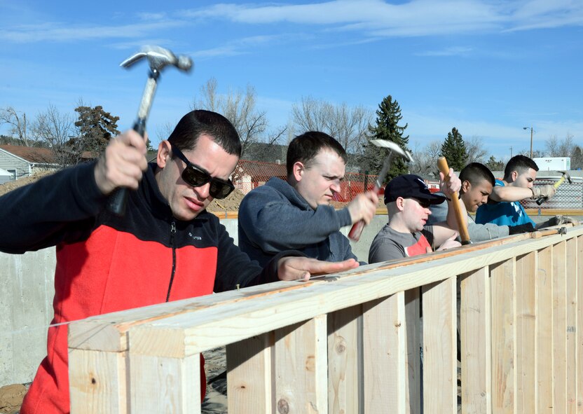 Members of the 28th Civil Engineer Squadron construct foundation support in a Habitat for Humanity home in Rapid City, S.D., March 23, 2017. During the event, members of the 28th CES contributed to the community, while heling strengthen their construction skills in the field. (U.S. Air Force photo by Airman 1st Class Donald C. Knechtel)