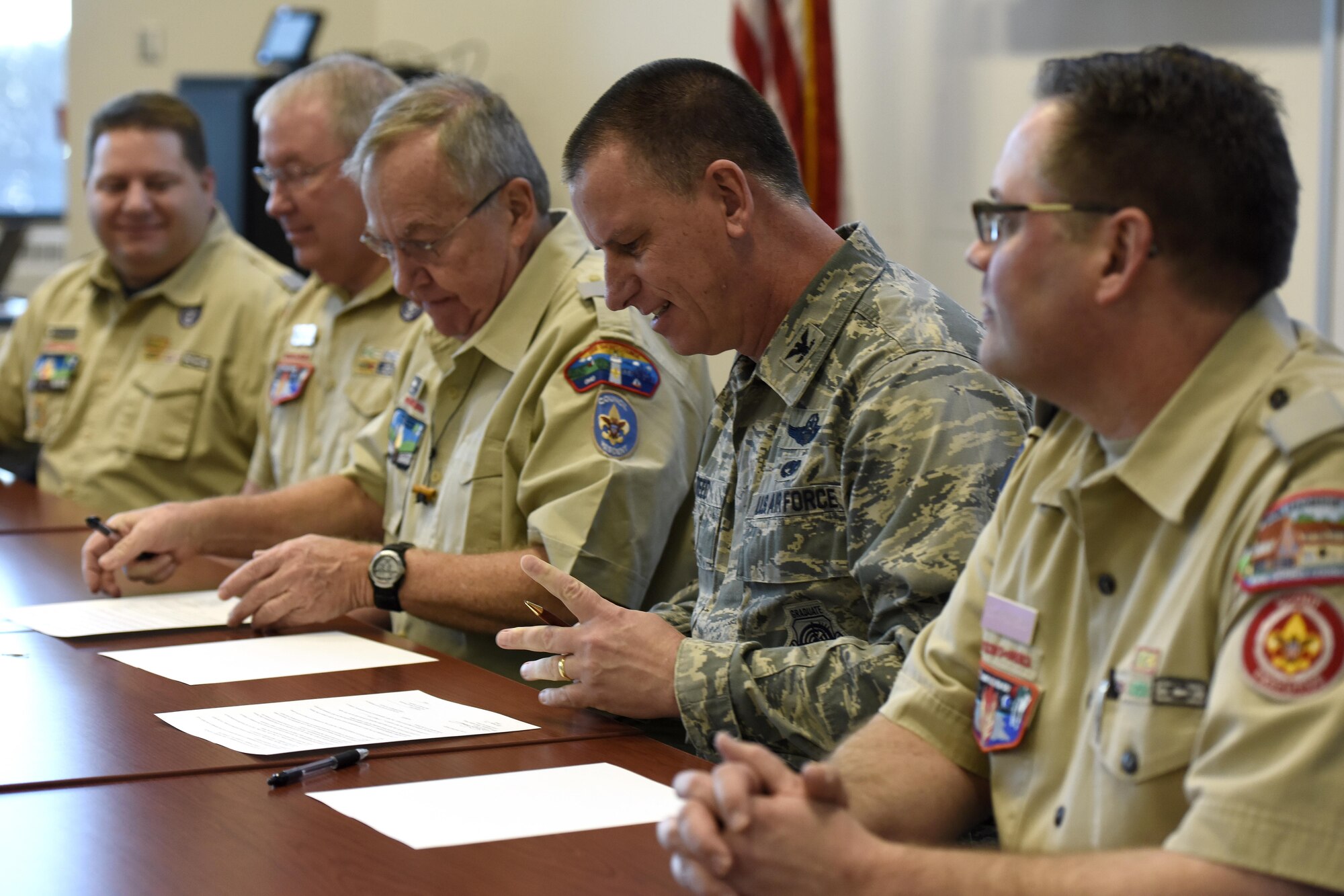 U.S. Air Force Col. Scott Reed, vice wing commander of the 180th Fighter Wing, Ohio Air National Guard, reviews a Memorandum of Understanding between the 180FW and the Boy Scouts of America's Erie Shores Council. The MOU with the Erie Shores Council provides a diverse leadership model to local Boy Scouts through exposure to 180FW Airmen and leaders, fostering a spirit of citizenship and civic responsibility while increasing event support, enhancing training opportunities and building stronger community relationships. (U.S. Air National Guard photo by Staff Sgt. Shane Hughes)