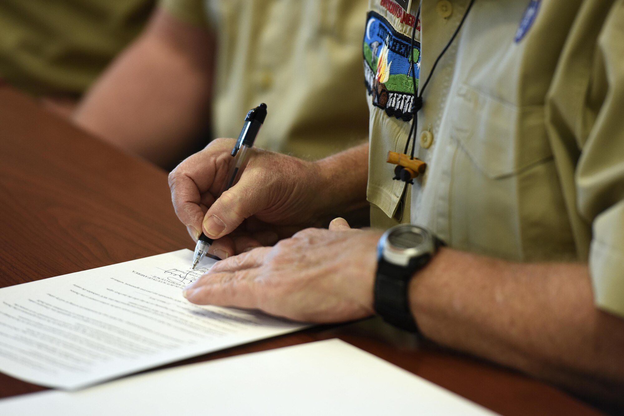 Ed Frey, president of the Eirie Shores Council, signs a Memorandum of Understanding between the 180th Fighter Wing and the Boy Scouts of America March 22, 2017 at the 180FW in Swanton, Ohio. The MOU provides a diverse leadership model to local Boy Scouts through exposure to 180FW Airmen and leaders, fostering a spirit of citizenship and civic responsibility while increasing event support, enhancing training opportunities and building stronger community relationships. (U.S. Air National Guard photo by Staff Sgt. Shane Hughes)