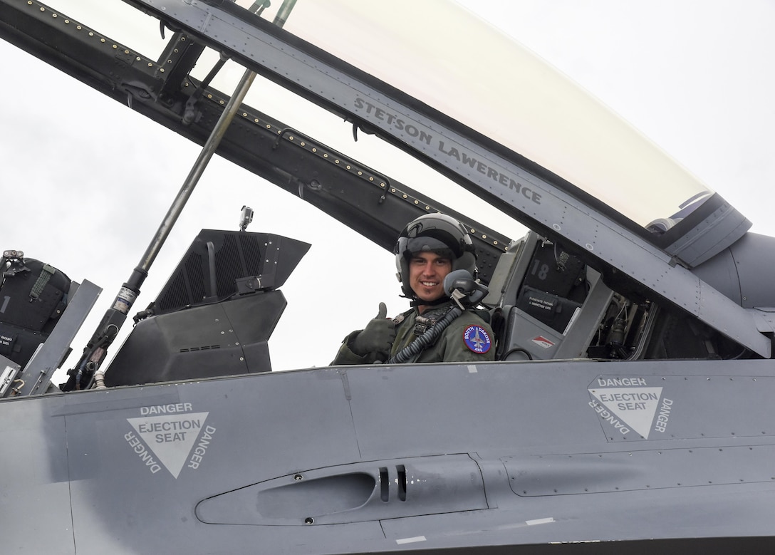 Professional Bull Rider Stetson Lawrence posed before his F-16 orientation ride at Joe Foss Field, S.D. on March 29, 2017. The PBR organization visited the 114th Fighter Wing as a part of a community outreach program. (Air National Guard photo by Staff Sgt. Duane Duimstra/Released)