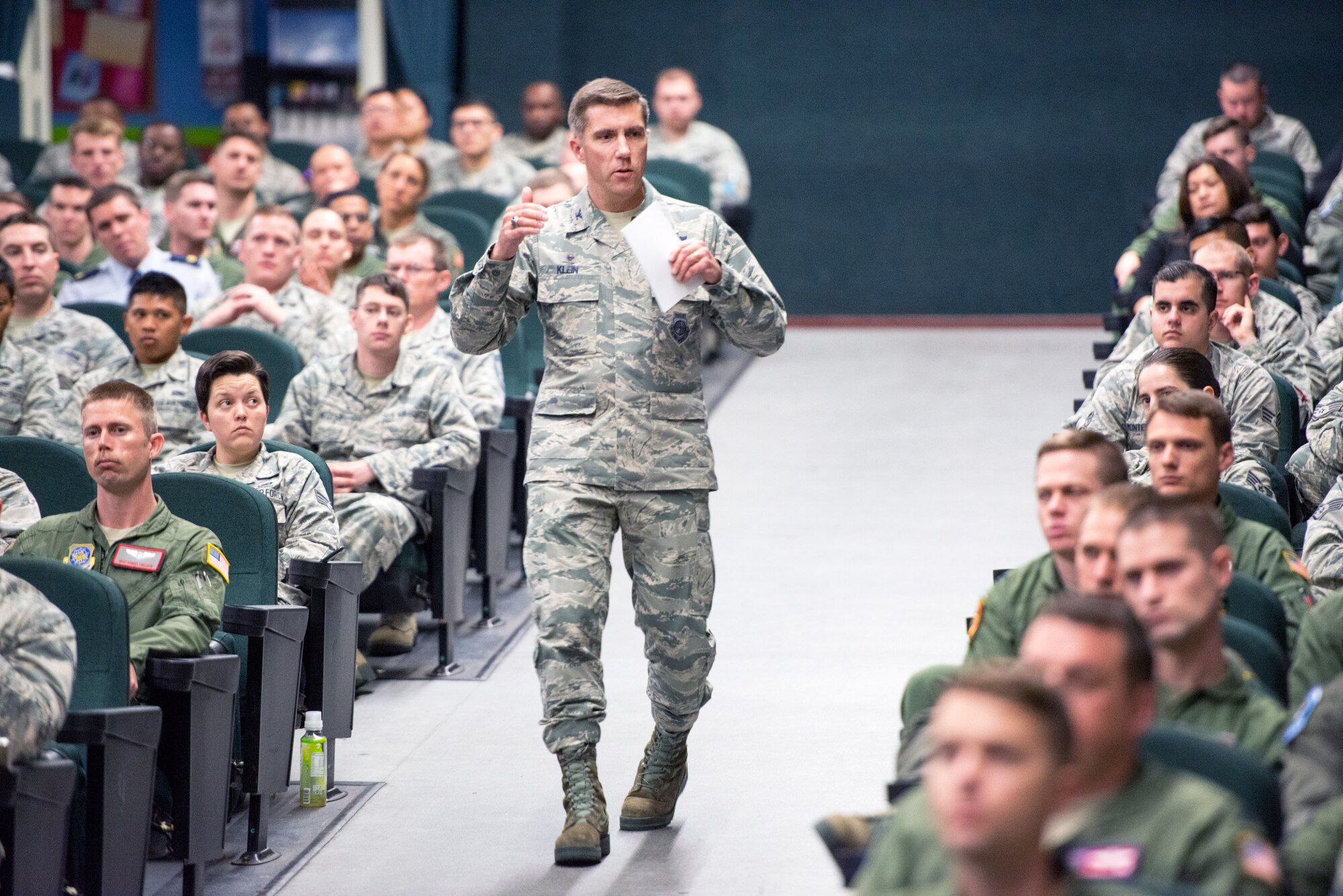 U.S. Air Force Col. John Klein, 60th Air Mobility Wing commander, addresses members of the wing during an commander's call at Travis Air Force Base, Calif., March 29, 2017. Klein discussed a variety of topics to unclude the Air Force Chief of Staff's three focus areas which are revitalizing squadrons, strengthening joint leaders and teams, and advancing multi-domain, multi-functional command and control. (U.S. Air Force photo by Louis Briscese)
