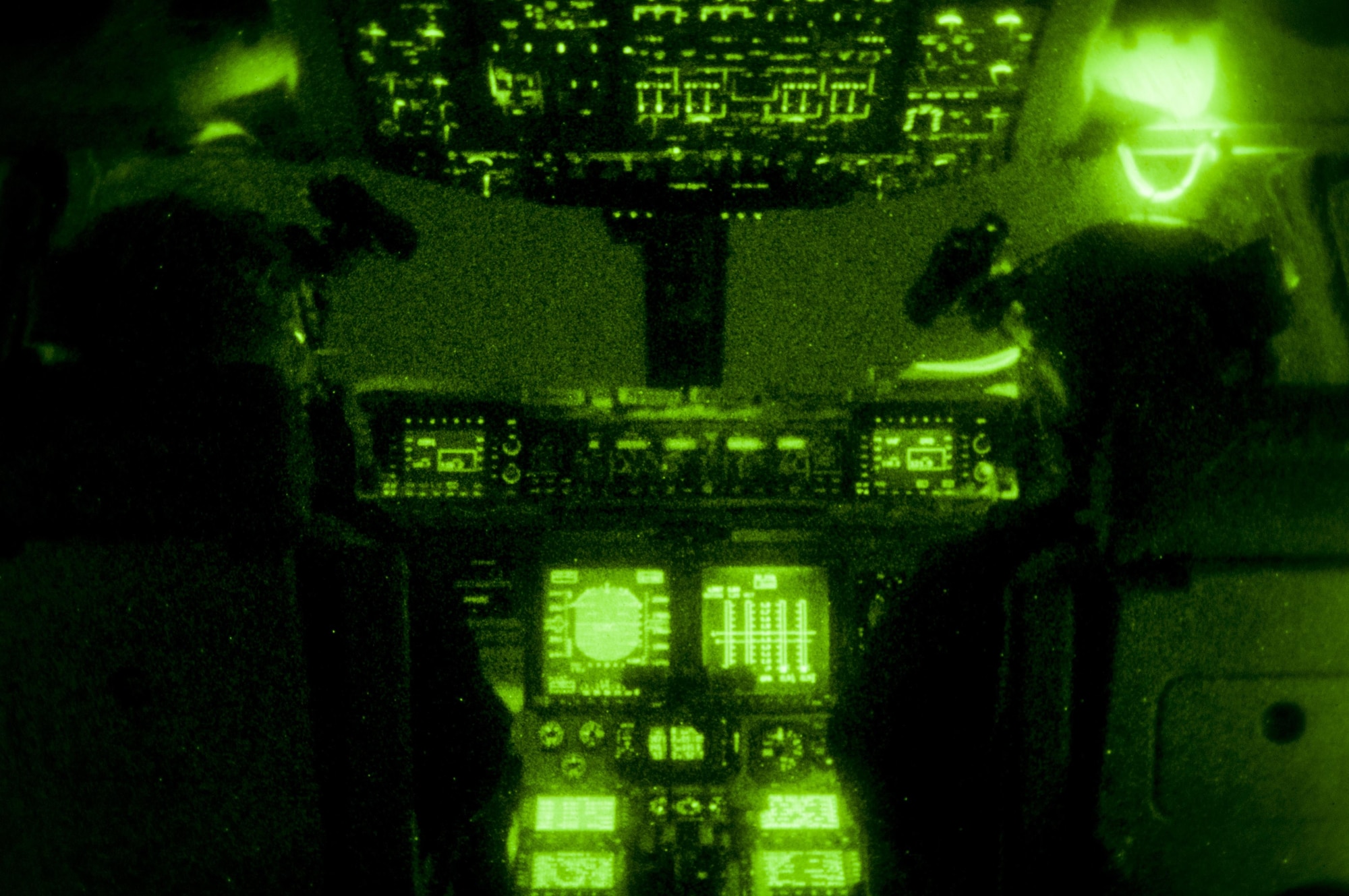 Captain Andrew Rast (left) and Lt. Col. J.W. Smith (right), 304th Expeditionary Airlift Squadron C-17 pilots, prepare to land a C-17 using night vision goggles on Pegasus Ice Runway near McMurdo Station, Antarctica July 15, 2016. Antarctica is the coldest, windiest, most inhospitable continent on the globe, and each trip to Antarctica requires careful planning and coordination. Operation Deep Freeze's new year-round operating seating opens doors for additional science and research to be conducted in support of the National Science Foundation-managed U.S.
Antarctic Program. (U.S. Air Force Reserve photo by Staff Sgt. Madelyn
McCullough)

