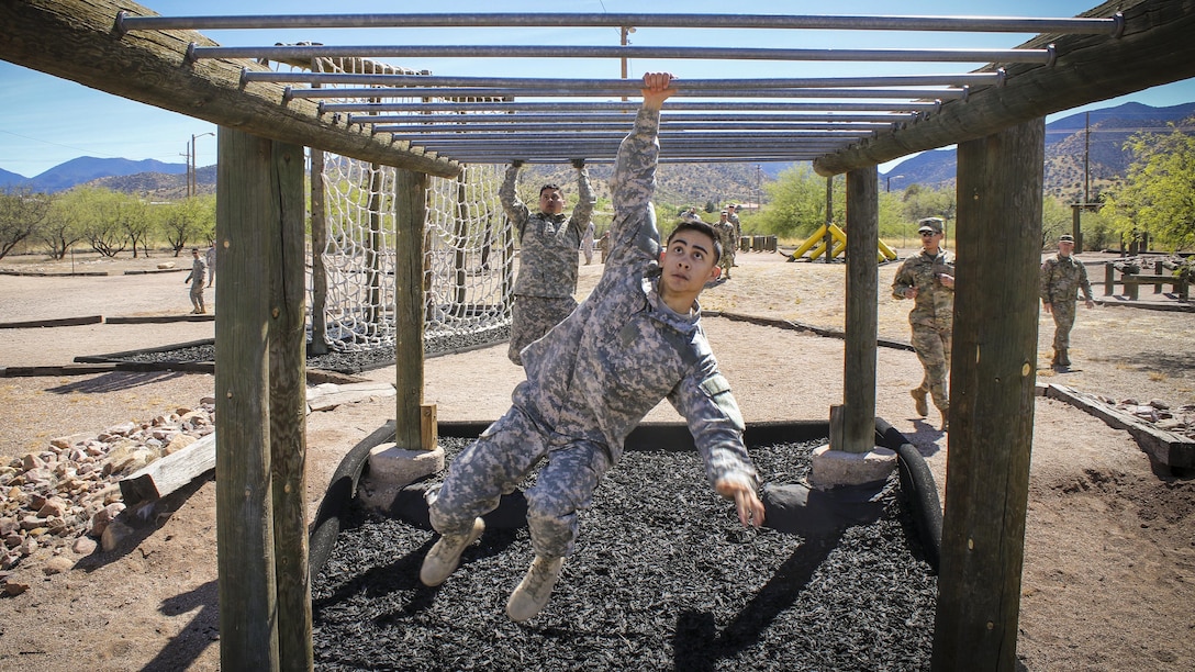 Army Spc. Julian Ditona swings across an obstacle at Fort Huachuca, Ariz., March 28, 2017. Ditona, a multichannel transmission systems operator/maintainer, is a reservist assigned to the 98th Expeditionary Signal Battalion, 335th Signal Command. He and seven other soldiers are competing in the command’s 2017 Best Warrior Competition, hoping to represent their unit at the main event later this year. Army Reserve photo by Sgt. 1st Class Brent C. Powell