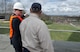 Peter Vielandi (left), Air Force District of Washington, and Sam Hunt, Air Force Memorial facility manager, discuss upcoming developments to the grounds surrounding the U.S. Air Force Memorial March 28, 2017 in Arlington, Va. In April 2017, the Air Force Memorial Foundation will hand off day-to-day operational responsibilities to AFDW. (U.S. Air Force photo by Staff Sgt. Joe Yanik)