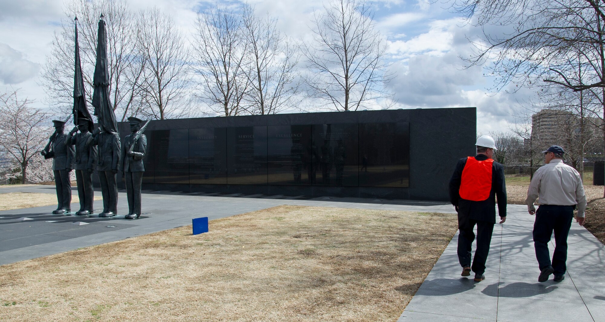 Peter Vielandi (left), Air Force District of Washington, and Sam Hunt, Air Force Memorial facility manager, walk past statues portraying Airmen from the U.S. Air Force Honor Guard March 28, 2017 at the U.S. Air Force Memorial in Arlington, Virginia. The Air Force Memorial Foundation, which dedicated the Memorial to the U.S. Air Force as a gift in 2006, has since maintained the memorial grounds and managed day-to-day operations.  (U.S. Air Force photo by Staff Sgt. Joe Yanik)