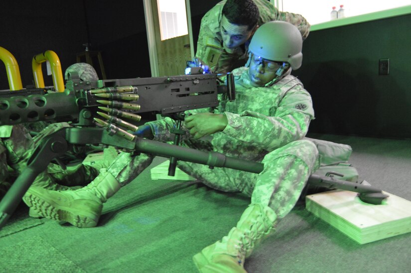 U.S. Army Reserve Sgt. Will Hoebeck Jr., a Petroleum Specialist with the 373rd Combat Sustainment Support Battalion based in Beaumont, Texas, gets instructions from the trainer on the M2 .50 caliber machine gun in the Engagement Skills Trainer during Operation Cold Steel, at Fort McCoy, Wis., Mar. 21, 2017.  Operation Cold Steel is the U.S Army Reserve’s crew-served weapons qualification and validation exercise to ensure that America’s Army Reserve units and Soldiers are trained and ready to deploy on short-notice bringing combat-ready and lethal firepower in support of the Total Army and our Joint Force anywhere in the world.  (U.S. Army Reserve photo by Master Sgt. Dave Thompson)