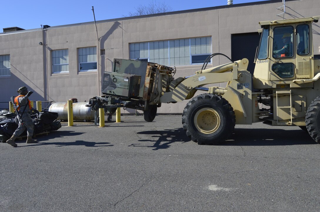 U.S. Army Reserve Soldiers Sgt. Nathan Butler (Driver), a Cargo Specialist, and Spc. Michael Trotter, a Transportation Management Coordinator with the 453rd Inland Cargo Transfer Cargo Transportation Company, team up to move a piece of equipment during WAREX 78-17-01 at Joint Base McGuire-Dix-Lakehurst March 23, 2017.  WAREX is a large-scale collective training event designed to simulate real-world events during combat. WAREX ensures that America’s Army Reserve units and Soldiers are trained and ready to deploy on short-notice bringing combat-ready and lethal firepower in support of the Total Army and our Joint Force anywhere in the world.  (U.S. Army Reserve photo by Master Sgt. Dave Thompson)