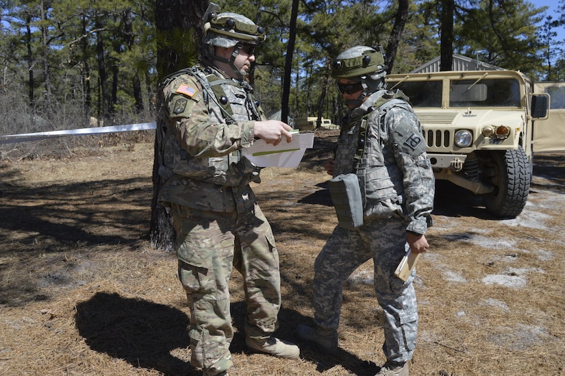 U.S. Army Reserve 1st Lt. Kristina Samuel, Commanding Officer of the 453rd Inland Cargo Transfer Cargo Transportation Company, confers with a soldier role-playing the opposing force during WAREX 78-17-01 at Joint Base McGuire-Dix-Lakehurst March 23, 2017.  WAREX is a large-scale collective training event designed to simulate real-world events during combat. WAREX ensures that America’s Army Reserve units and Soldiers are trained and ready to deploy on short-notice bringing combat-ready and lethal firepower in support of the Total Army and our Joint Force anywhere in the world.  (U.S. Army Reserve photo by Master Sgt. Dave Thompson)