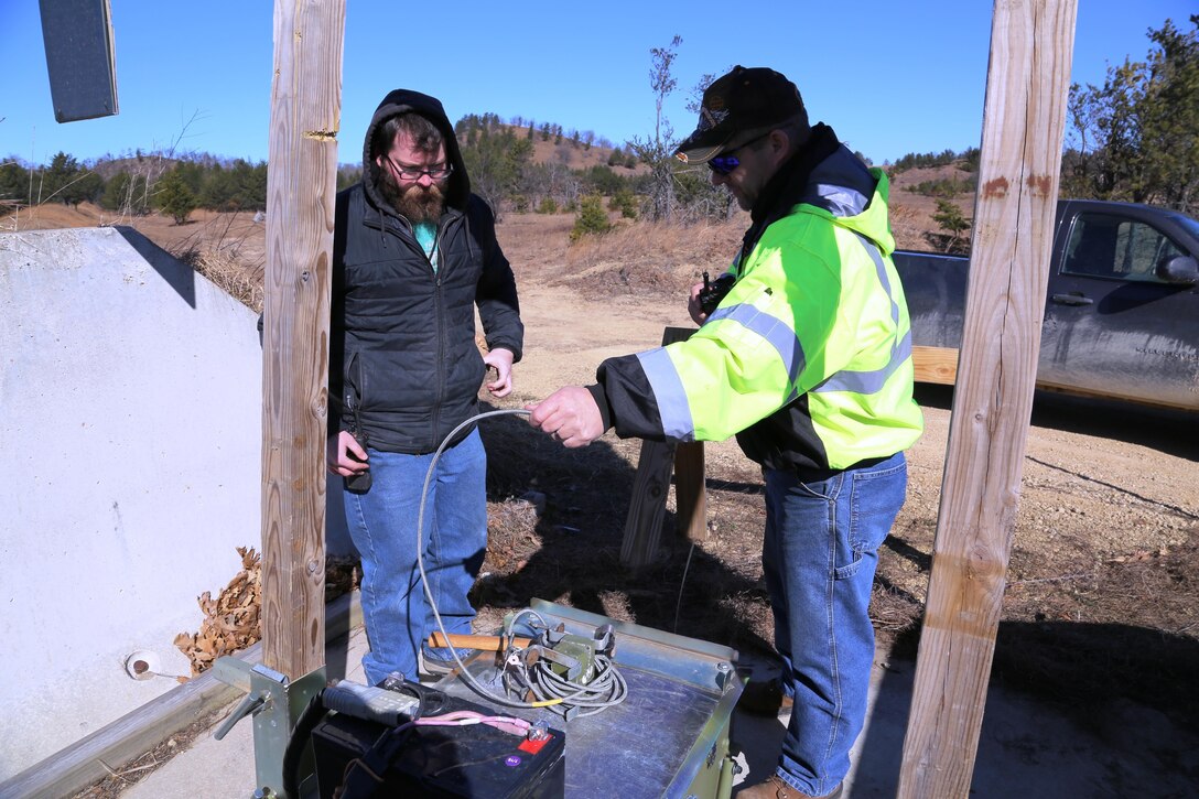 Bruce Altman, target systems supervisor, and Jared Matthews, target systems worker, both with the Directorate of Plans, Training, Mobilization and Security Range Maintenance team, work on an automated target March 10, 2017, on Range 2 on North Post at Fort McCoy, Wis. The work was in preparation for range use by service members training in Operation Cold Steel, an Army Reserve exercise. Range Maintenance personnel make sure range and training areas at Fort McCoy remain operational, and they take care of service members as they train on the ranges. Range Maintenance also has engineering personnel who complete various projects for the installation range complex. (U.S. Army Photo by Scott T. Sturkol, Public Affairs Office, Fort McCoy, Wis.)