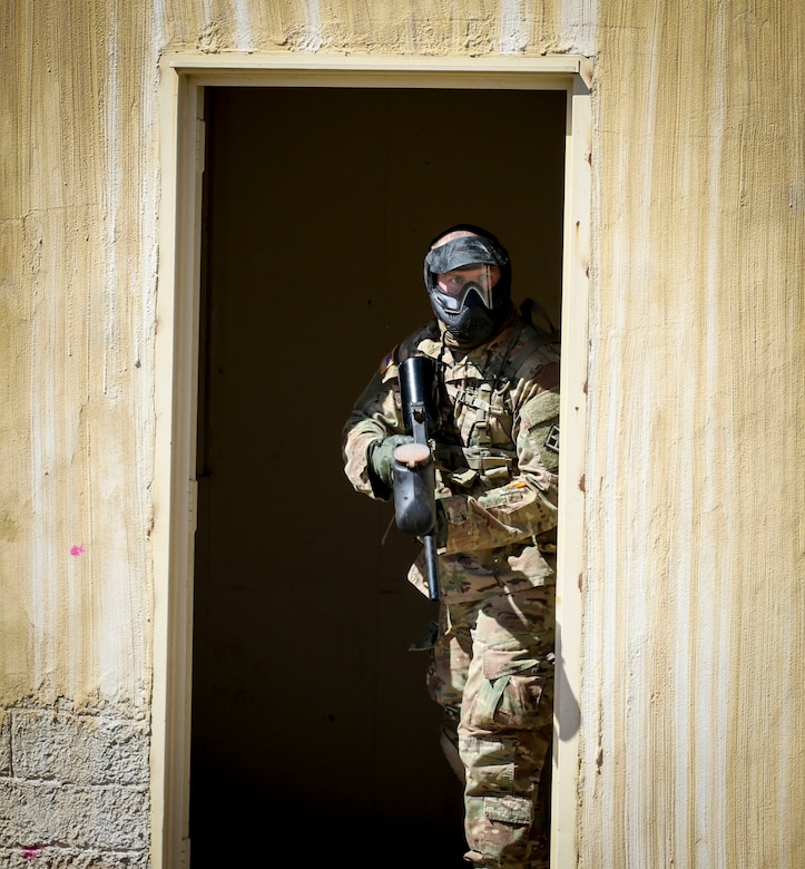 Army Reserve Staff Sgt. Clifford Arrington, an information technology specialist, assigned to Defense Information Systems Agency, Army Reserve Element, 335th Signal Command (Theater), keeps an eye out for enemy movement during and urban operations scenario at the command's 2017 Best Warrior Competition at Fort Huachuca, Arizona, March 29.  Eight Soldiers are competing in the five-day competition to see who will go on to represent the command in the U.S. Army Reserve Command's Best Warrior Competition later this year.  (Official U.S. Army photo by Sgt. 1st Class Brent C. Powell)