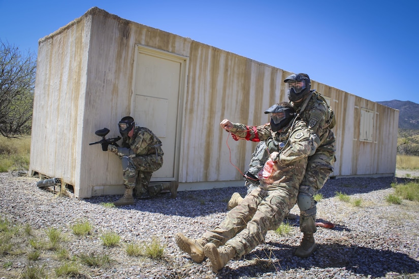 Army Reserve Sgt. Anderson Rodriguez, a satellite communications operator/maintainer, assigned to the Joint Communications Squadron, 4th Joint Communications Support Element, 335th Signal Command (Theater), pulls a wounded role-player to safety after an Improvised Explosive Device detonated during an urban operations scenario at the command's 2017 Best Warrior Competition at Fort Huachuca, Arizona, March 29.  Eight Soldiers are competing in the five-day competition to see who will go on to represent the command in the U.S. Army Reserve Command's Best Warrior Competition later this year.  (Official U.S. Army photo by Sgt. 1st Class Brent C. Powell)