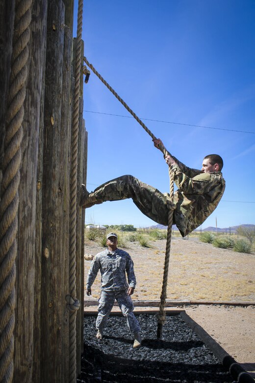 Army Reserve Spc. Joshua Anderson, an information technology specialist, assigned to the 335th Signal Command (Theater), uses a rope to climb a wooden wall obstacle at the obstacle course challenge at Fort Huachuca, Arizona March 28. Anderson and seven other Soldiers are competing in the command’s 2017 Best Warrior Competition, in hopes of representing their unit at the U.S. Army Reserve Commands 2017 Best Warrior Competition later this year. (Official U.S. Army Reserve photo by Sgt. 1st Class Brent C. Powell)