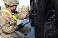 Spc. Edgardo Melendez, motor transport operator, 18th Combat Sustainment Support Battalion, 16th Sustainment Brigade, inflates tires on a truck in preparation for the first convoy to roll off the port in Gdansk, Poland, March 29, 2017.  More than 640 pieces of military equipment, including 311 pieces of rolling stock and 155 containers from 17 active duty, U.S. Army Reserve and Army National Guard units arrived in Gdansk to provide support to Soldiers participating in Atlantic Resolve. (U.S. Army photo by Sgt. 1st Class Jacob A. McDonald)