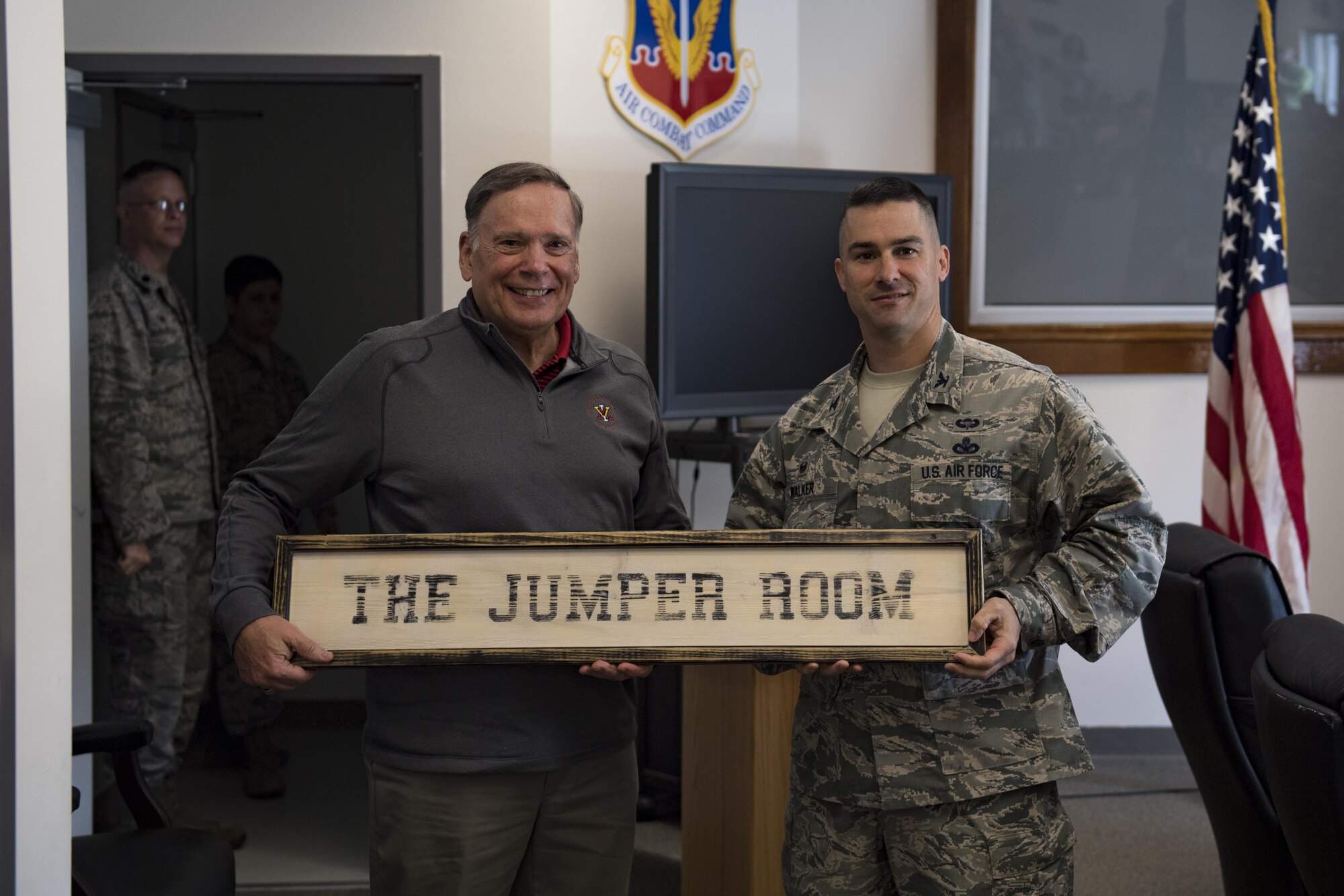 Retired chief of staff Gen. John Jumper, left, and Col. Kevin Walker, 820th Base Defense Group commander, pose for a photo after dedicating a conference room to Jumper during the 820th Base Defense Group’s 20th Anniversary Ceremony, March 28, 2017, at Moody Air Force Base, Ga. Jumper was a command pilot with more than 5,000 flying hours, including 1,400 combat hours. The celebration included an 820th BDG capabilities demo, a reenlistment ceremony and a formal dinner. (U.S. Air Force photo by Airman 1st Class Daniel Snider)