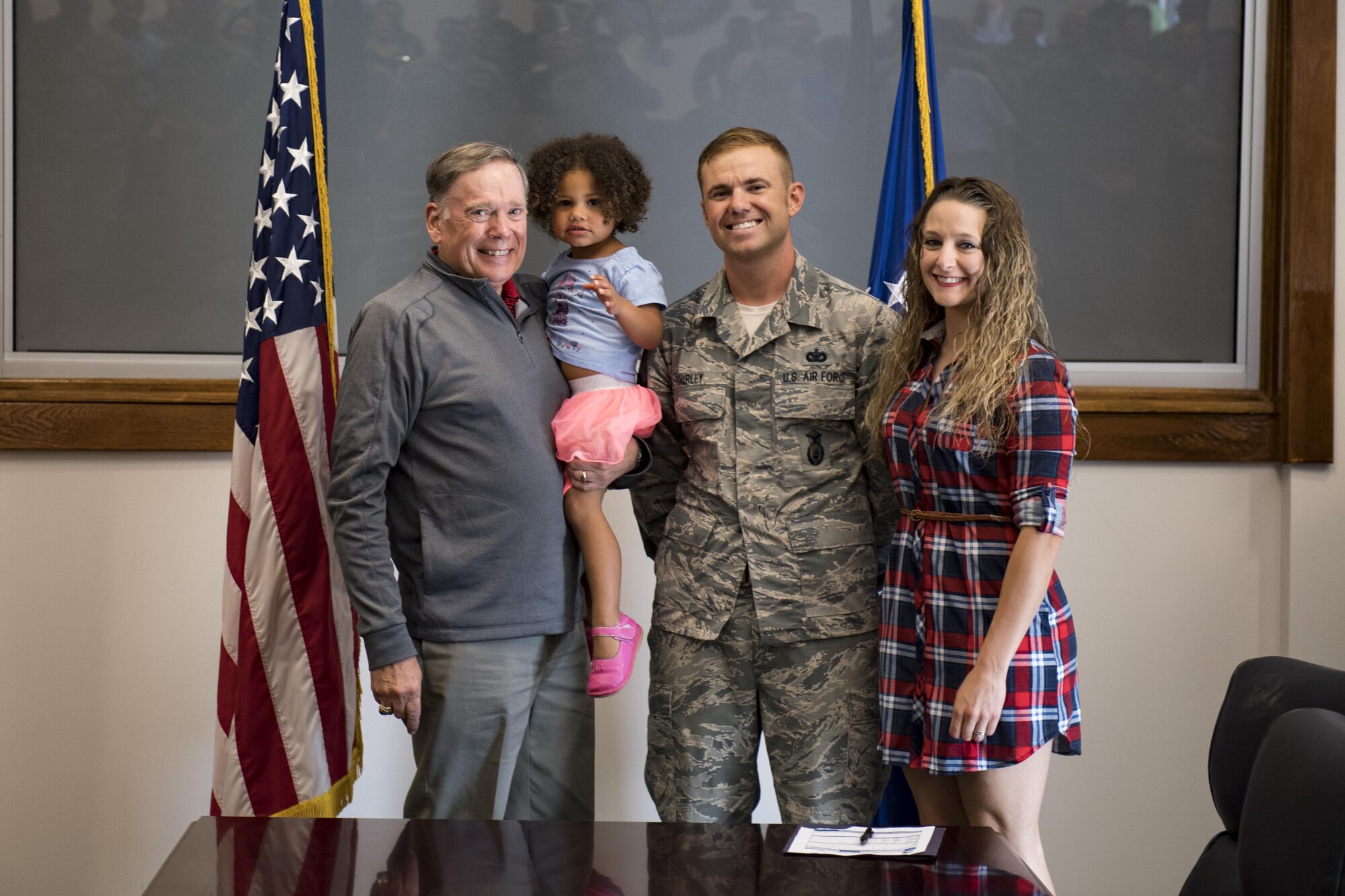 Retired chief of staff Gen. John Jumper poses for a photo with Staff Sgt. Scott Shirley, 824th Base Defense Squadron NCO in charge of plans and programs, and his family during the 820th Base Defense Group’s 20th Anniversary Ceremony, March 28, 2017, at Moody Air Force Base, Ga. Jumper was a command pilot with more than 5,000 flying hours, including 1,400 combat hours. The celebration included an 820th BDG capabilities demo, a reenlistment ceremony and a formal dinner. (U.S. Air Force photo by Airman 1st Class Daniel Snider)