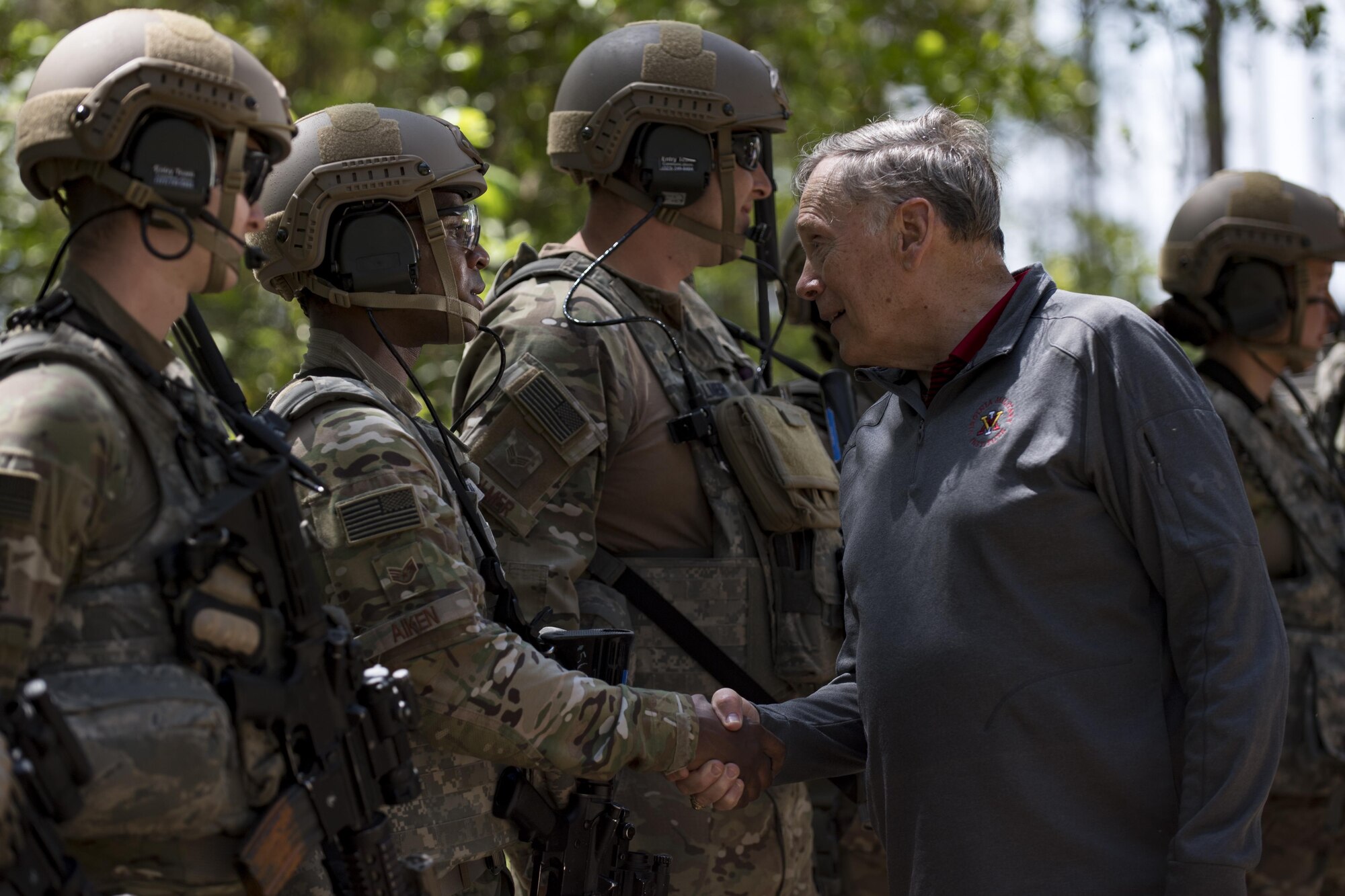 Retired chief of staff Gen. John Jumper shakes hands with Staff Sgt. Justin Aiken, 822d Base Defense Squadron fire team leader, during the 820th Base Defense Group’s 20th Anniversary Ceremony, March 28, 2017, at Moody Air Force Base, Ga. Jumper was a command pilot with more than 5,000 flying hours, including 1,400 combat hours. The celebration included an 820th BDG capabilities demo, a reenlistment ceremony and a formal dinner. (U.S. Air Force photo by Airman 1st Class Daniel Snider)