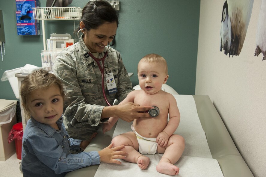 Capt. Manisha Mills, a 49th MDOS pediatrician, checks her patient's heart rate March 29, 2017 at Holloman Air Force Base, N.M. Mills' framework consists of about 20-23 appointments per day and in between those appointments, she takes walk-in clients. (U.S. Air Force photo by Airman 1st Class Ilyana A. Escalona)