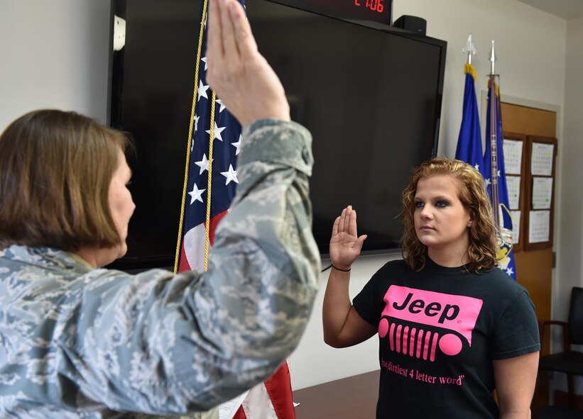 U.S. Air Force Reserve Maj. Polly Orcutt administers the oath of enlistment to Shana Peacock here, March 24. Peacock enlisted to become a loadmaster with the 757th Airlift Squadron, and is preparing for basic training. For information on joining the Air Force Reserve, visit www.afreserve.com. (U.S. Air Force photo/Eric White)
