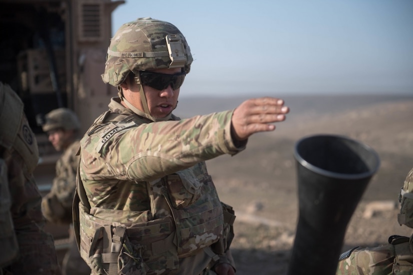 Army Pfc. Gabriel Gomes, assigned to 2nd Battalion, 325th Airborne Infantry Regiment, calls for direction of fire while manning a mortar firing position near Mosul, Iraq, in support of Operation Inherent Resolve, Feb. 28, 2017. Army photo by Staff Sgt. Alex Manne
