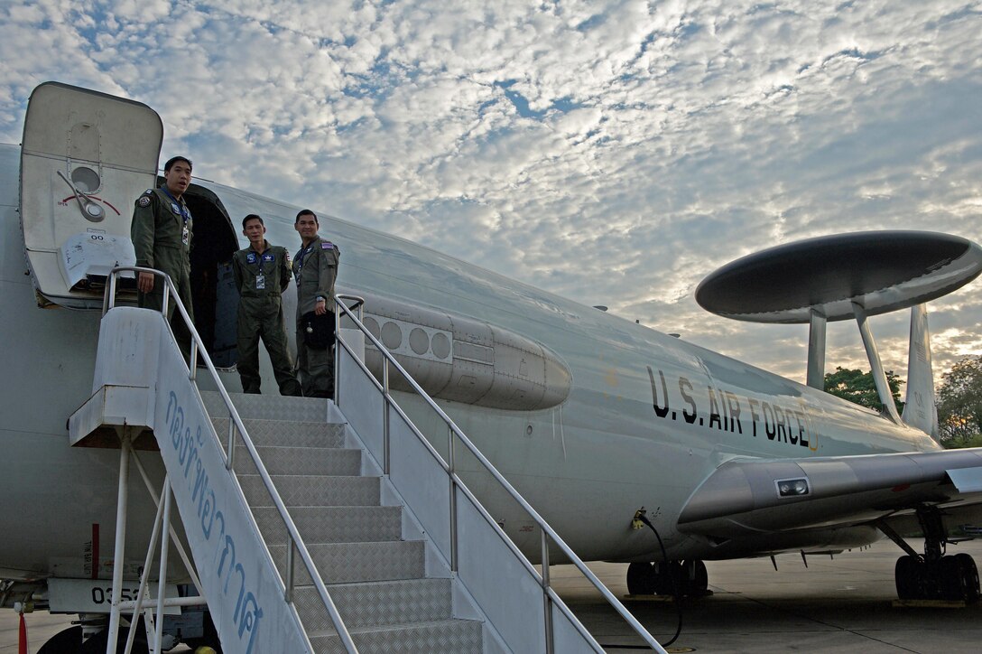 Three members of the Royal Thai air force board a U.S. Air Force E-3 Sentry Airborne Warning and Control System (AWACS) for a mission during exercise Cope Tiger 17 at Korat Royal Thai Air Force Base, Thailand, March 28, 2017. The E-3 provides airborne command and control, long-range surveillance, detection and identification information, further maximizing interoperability between the U.S., Thai and Singapore militaries which is essential in tackling non-traditional security challenges such as maritime security and terrorism. (U.S. Air Force photo by Staff Sgt. Kamaile Chan)