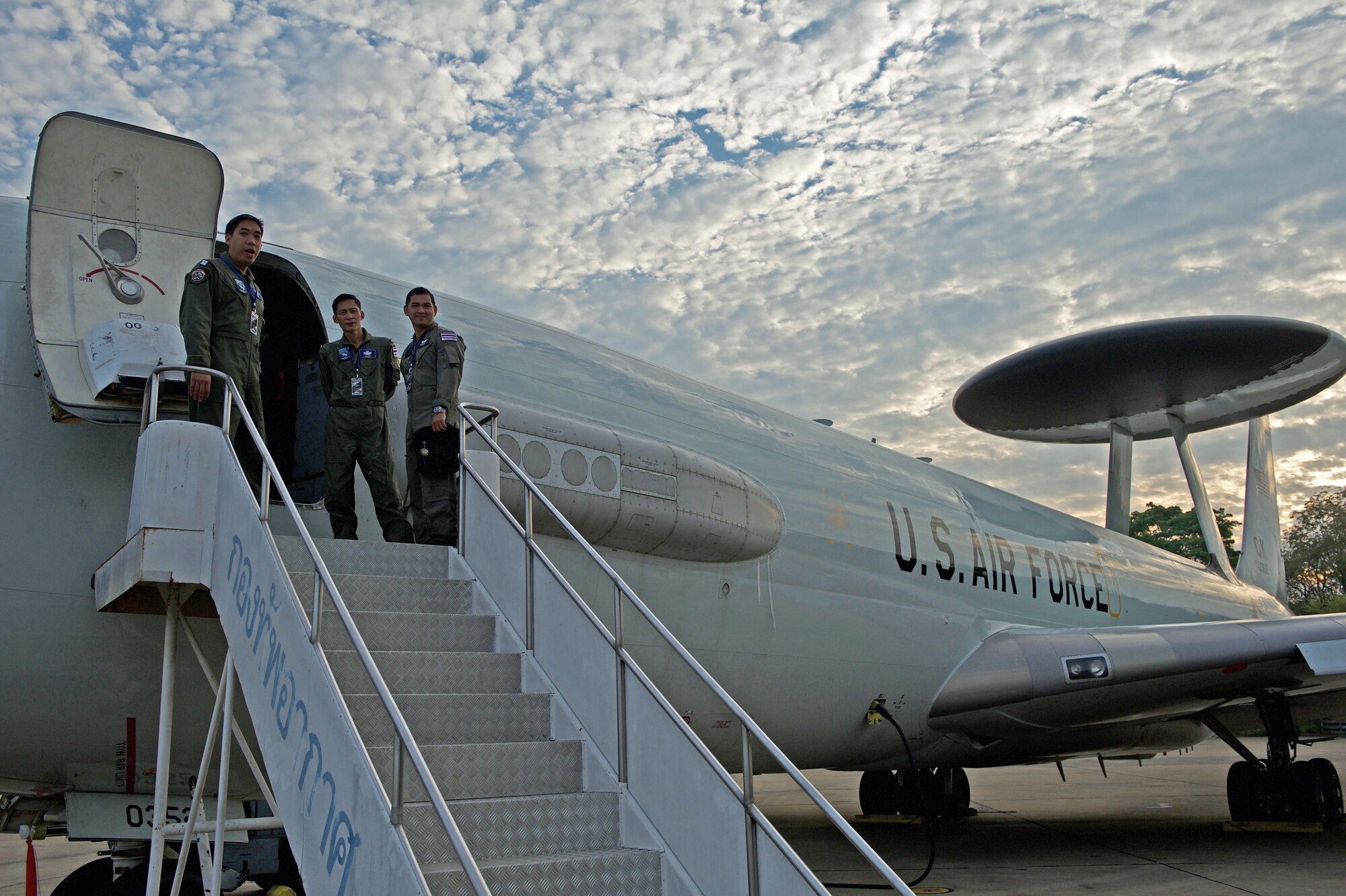 Three members of the Royal Thai air force board a U.S. Air Force E-3 Sentry Airborne Warning and Control System (AWACS) for a mission during exercise Cope Tiger 17 at Korat Royal Thai Air Force Base, Thailand, March 28, 2017. The E-3 provides airborne command and control, long-range surveillance, detection and identification information, further maximizing interoperability between the U.S., Thai and Singapore militaries which is essential in tackling non-traditional security challenges such as maritime security and terrorism. (U.S. Air Force photo by Staff Sgt. Kamaile Chan)