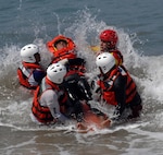 First responders from the Mexican states of Jalisco and Michoacán practice bringing a drowning victim to shore using a rescue sled donated by U.S. Northern Command in Puerto Vallarta, Mexico, March 22, 2017. As part of USNORTHCOM's humanitarian assistance mission, members of the U.S. Public Health Service provided water search and rescue training to Mexican first responders. (Photo by U.S. Air Force 1st Lt. Lauren Hill/Released)