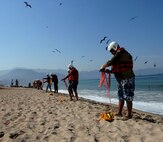 First responders from the Mexican states of Jalisco and Michoacán practice rope-throwing techniques during water search and rescue training in Puerto Vallarta, Mexico, March 22, 2017. U.S. Northern Command donated equipment and conducted a week of exercises for Mexican first responders to enhance their water search and rescue techniques. (Photo by U.S. Air Force 1st Lt. Lauren Hill/Released)