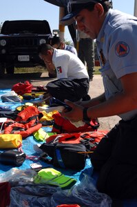 A first responder from the Mexican state of Michoacán’s Civil Protection takes inventory of his new equipment donated by U.S. Northern Command in Puerto Vallarta on March 20, 2017. This is part of USNORTHCOM's partnership with Mexico to train and equip Mexican first responders as USNORTHCOM donated $270,000 of water search and rescue gear. (Photo by U.S. Air Force 1st Lt. Lauren Hill/Released)
