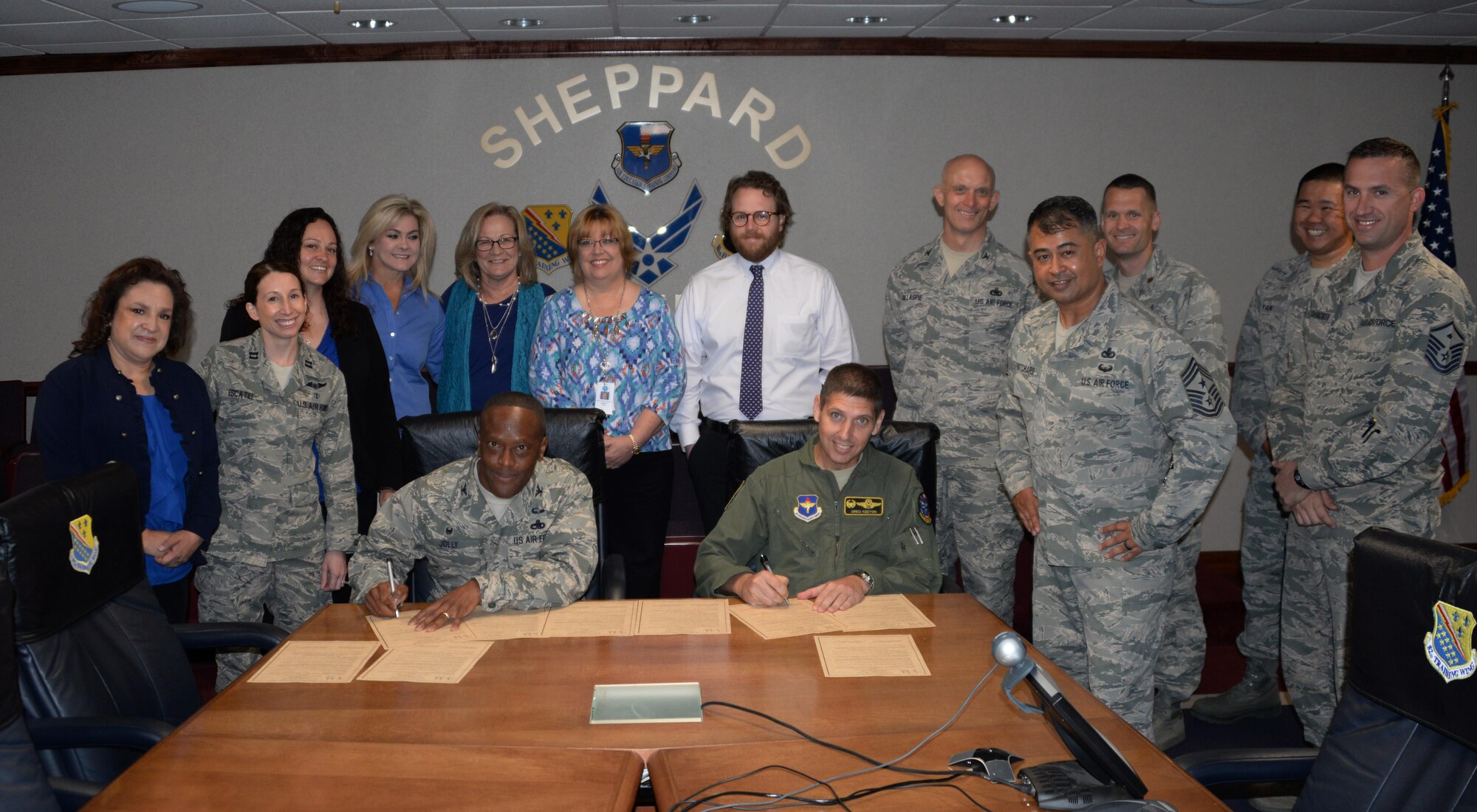 Col. Ronald Jolly, 82nd Training Wing commander and Col. Gregory Keeton, 80th Flying Training Wing commander, support Child Abuse Prevention Month by signing a proclamation March 30, 2017. Throughout the month of April, Family Advocacy and several other agencies will be hosting events to remind Team Sheppard of the resources available to them to help prevent and stop child abuse. (U.S. Air Force photo by Senior Airman Robert L. McIlrath/Released)