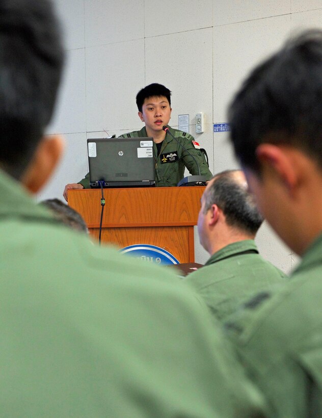 A Republic of Singapore air force pilot conducts a mass briefing for over 100 members of the Royal Thai air force (RTAF), Republic of Singapore air force (RSAF) and U.S. Air Force (USAF) during exercise Cope Tiger 17 at Korat Royal Thai Air Force Base, Thailand, March 29, 2017. The annual multilateral exercise, which involves a combined total of 76 aircraft and 43 air defense assets, is aimed at improving combined combat readiness and interoperability between the RSAF, RTAF, and USAF, while concurrently enhancing the three nations' military relations. (U.S. Air Force photo by Staff Sgt. Kamaile Chan)
