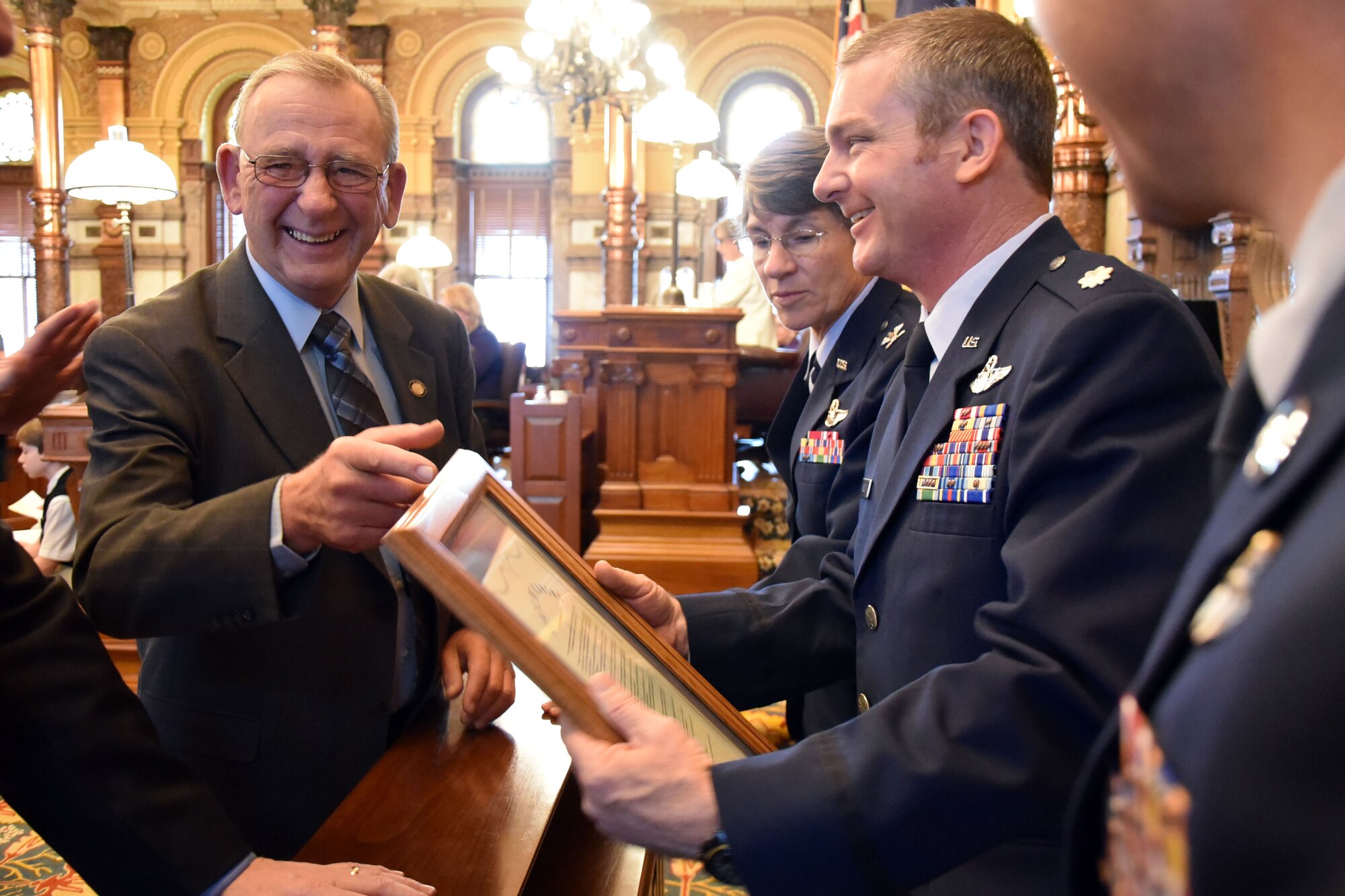 (Right to left) Sen. Dan Goddard, Kansas State Senate District 15, presents Col. Caroline Evernham, 931st Operations Group commander, Lt. Col. Terry McGee, incoming 924th Air Refueling Squadron commander, and Senior Master Sgt. Jay Guldjord, 18th Air Refueling Squadron boom operator, with a plaque detailing the Senate Resolution honoring the 924th Air Refueling Squadron March 30, 2017, Topeka, Kan. The event took place during an official session. The 931st Operations Group will stand up the 924th Air Refueling Squadron in an official ceremony scheduled April 2, 2017. It is the first squadron in the Air Force dedicated to the KC-46A Pegasus.  (U.S. Air Force photo by Tech. Sgt. Abigail Klein)