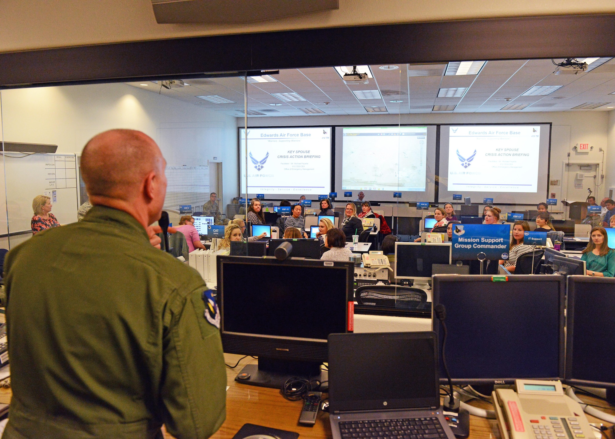 Brig. Gen. Carl Schaefer, 412th Test Wing commander, gives opening remarks to 40 military spouses at the Crisis Action Team building March 27. The training event gave spouses an inside look at emergency operations. (U.S. Air Force photo by Kenji Thuloweit) 
