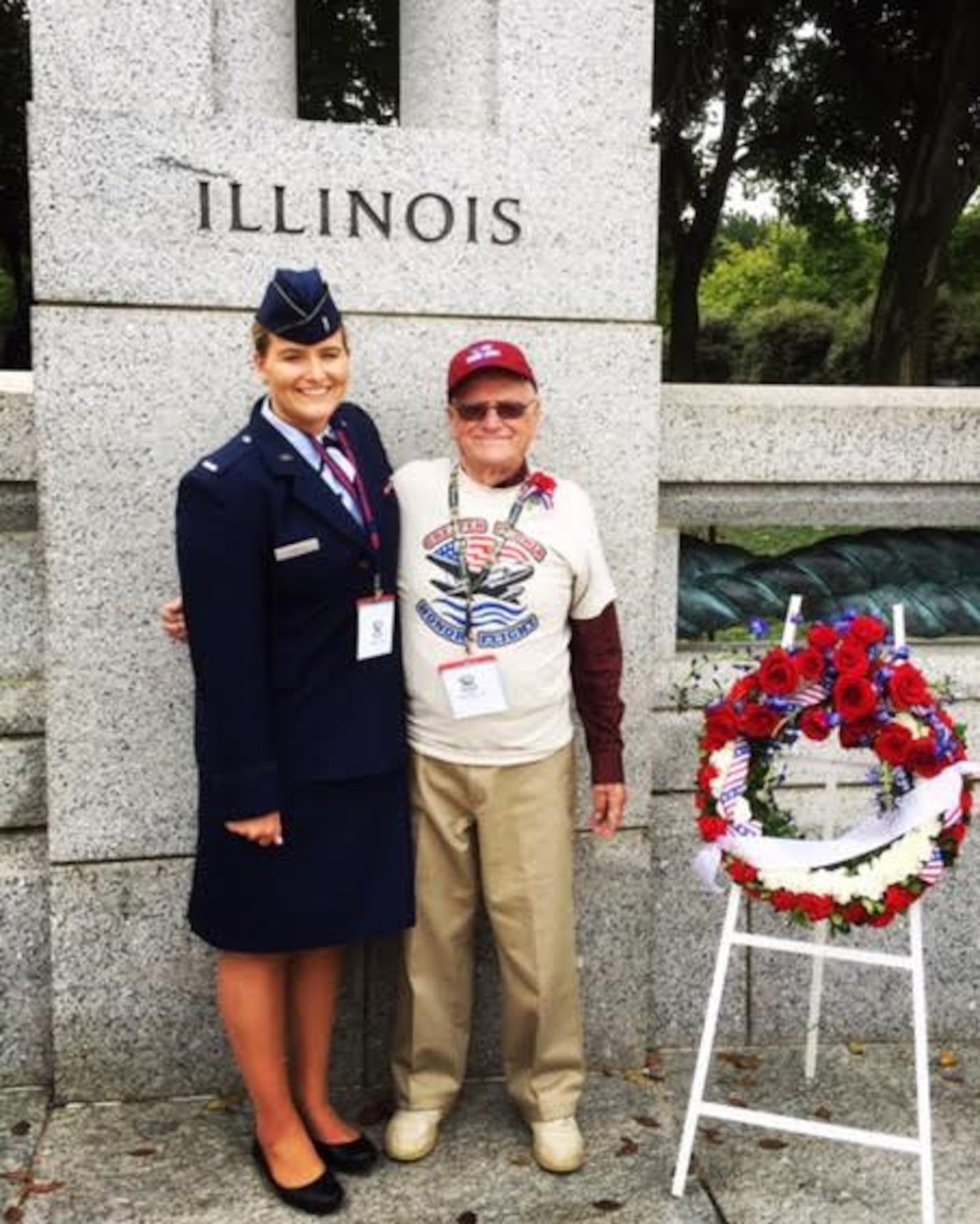 1st Lt. Ashley Christ, 30th Force Support Squadron military personnel section chief, and her grandfather and Korean War veteran, Donald Messner, pose for a photo in front of the National World War II Memorial, Sept. 27, 2016, Washington D.C. (Courtesy Photo)