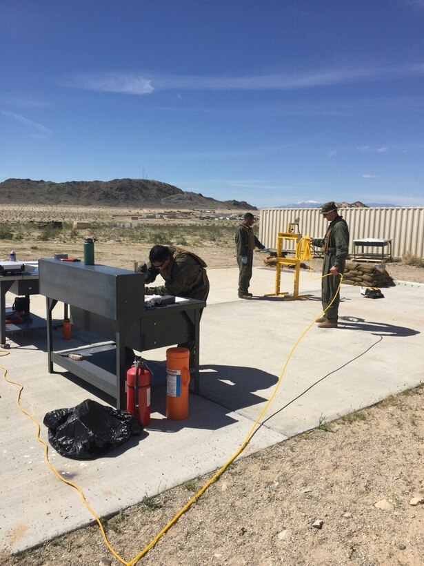 Students of Explosive Ordnance Disposal Advanced Training Center (EODATC) Explosive Ordnance Exploitation Course Class 020-2017 utilize a pneumatic press.  The press was used to demonstrate various methods to remove explosives remotely.                